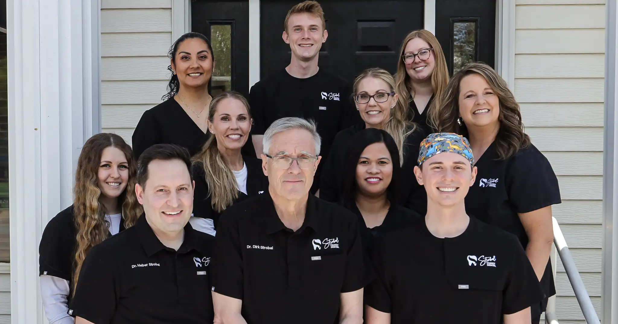 team photo of strobel employees to show strobel family dental team