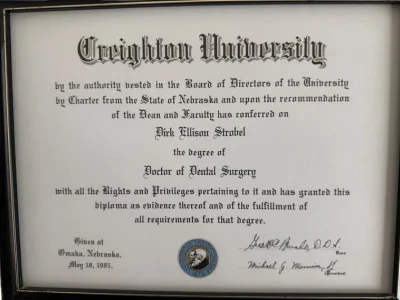 Doctor of Dental Surgery diploma conferred on Dirk Ellison Strobel by Creighton University in Omaha, Nebraska on May 18, 1985. Caption: Doctor of Dental Surgery, Creighton University, Omaha, Nebraska. Conferred May 18, 1985.